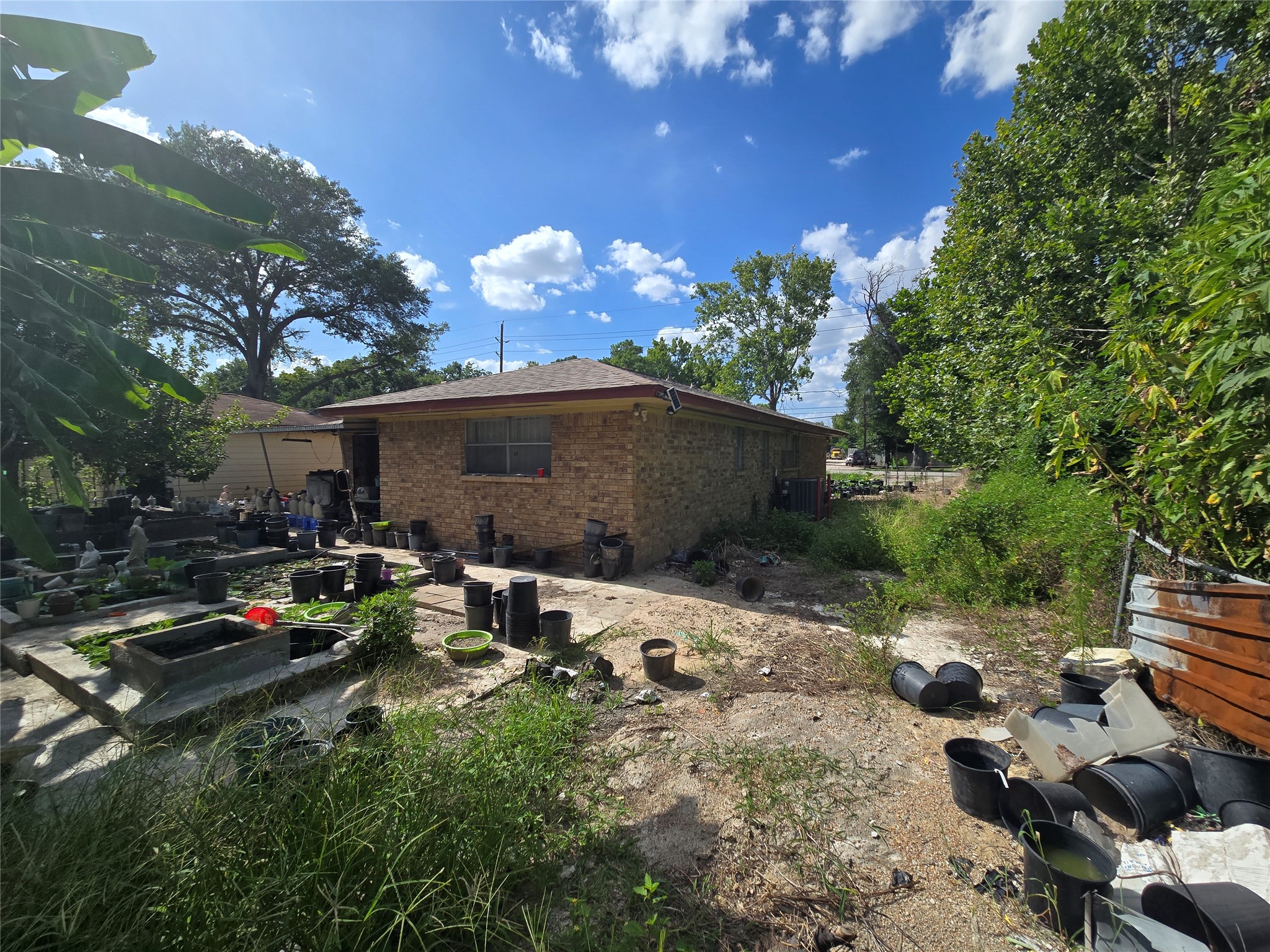 6713 Breen Drive Houston, TX 77086 - Photo 14 of 21 a view of backyard with swimming pool and outdoor seating