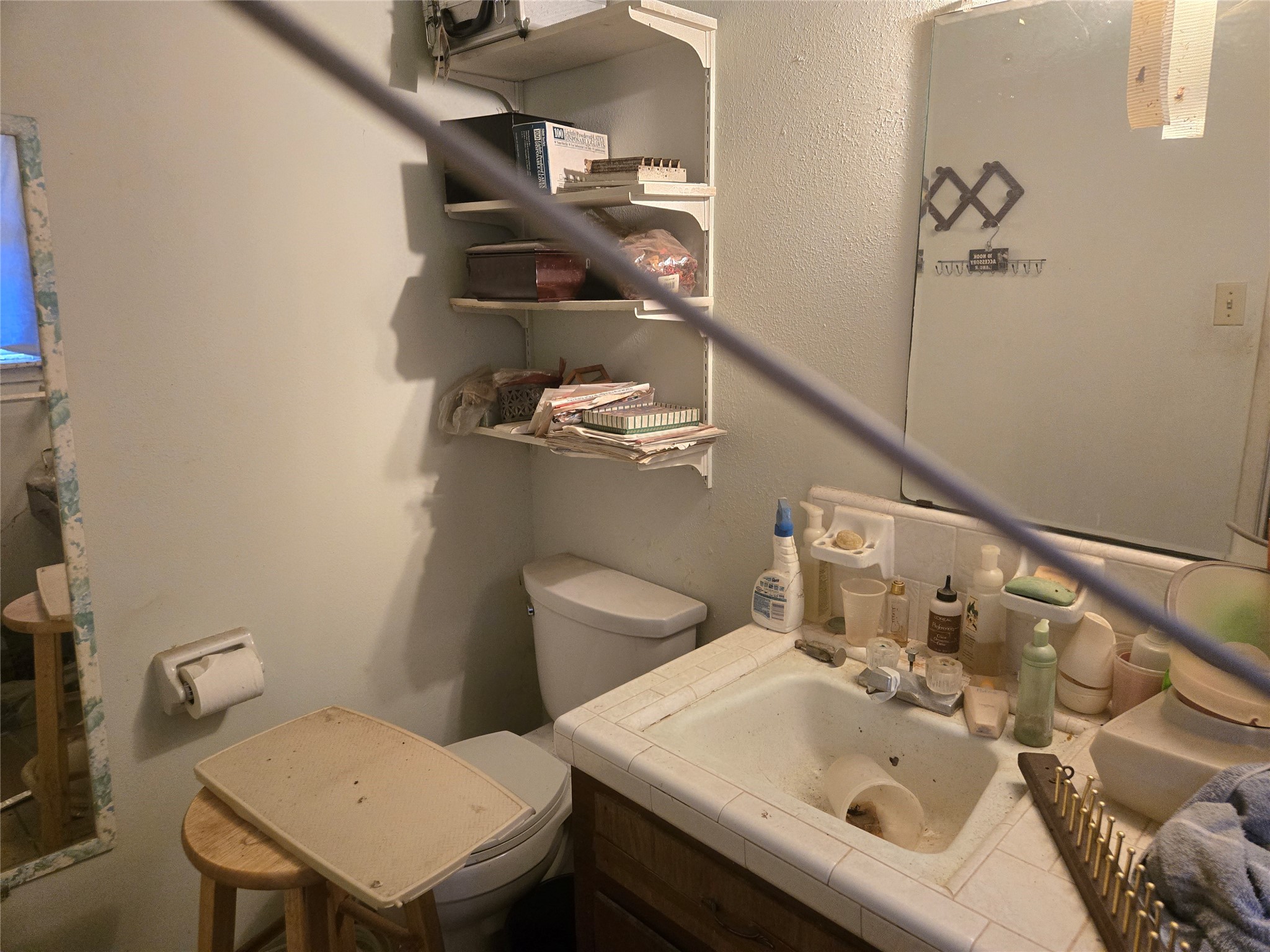 6713 Breen Drive Houston, TX 77086 - Photo 3 of 21 a bathroom with a sink and a toilet