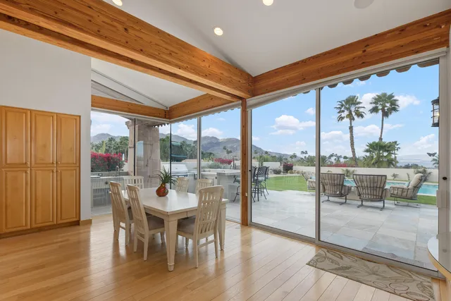a view of a dining room with furniture window and outside view