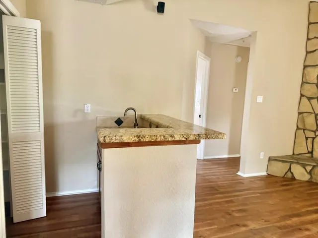a view of a bathroom with a sink and a mirror