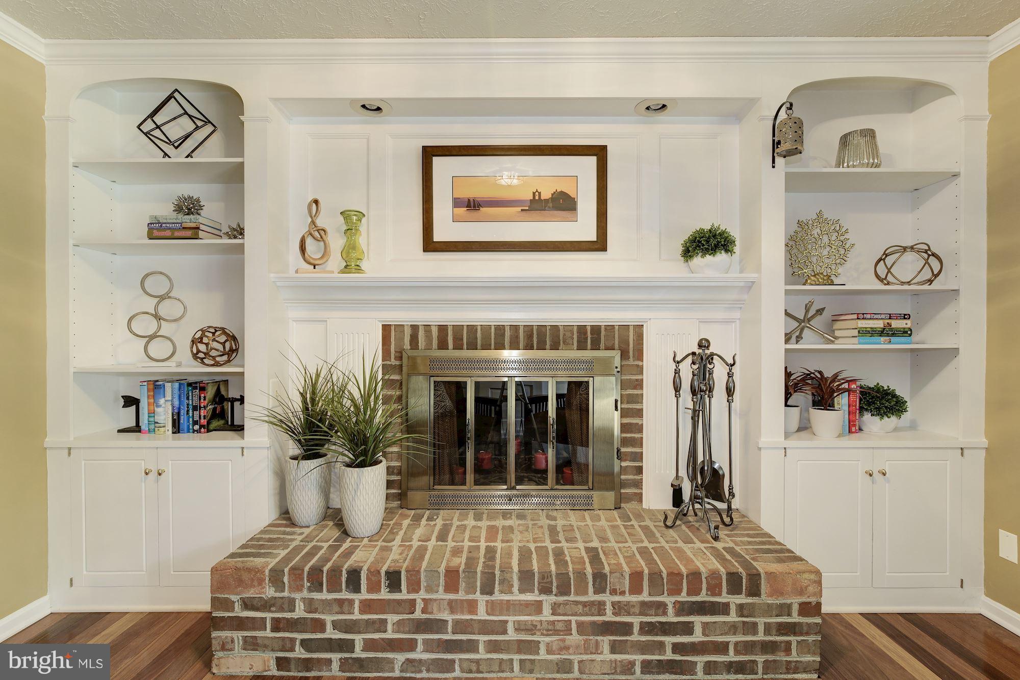 7317 Jenna Road Springfield, VA 22153 - Photo 12 of 30 Brick fireplace and gorgeous built-ins