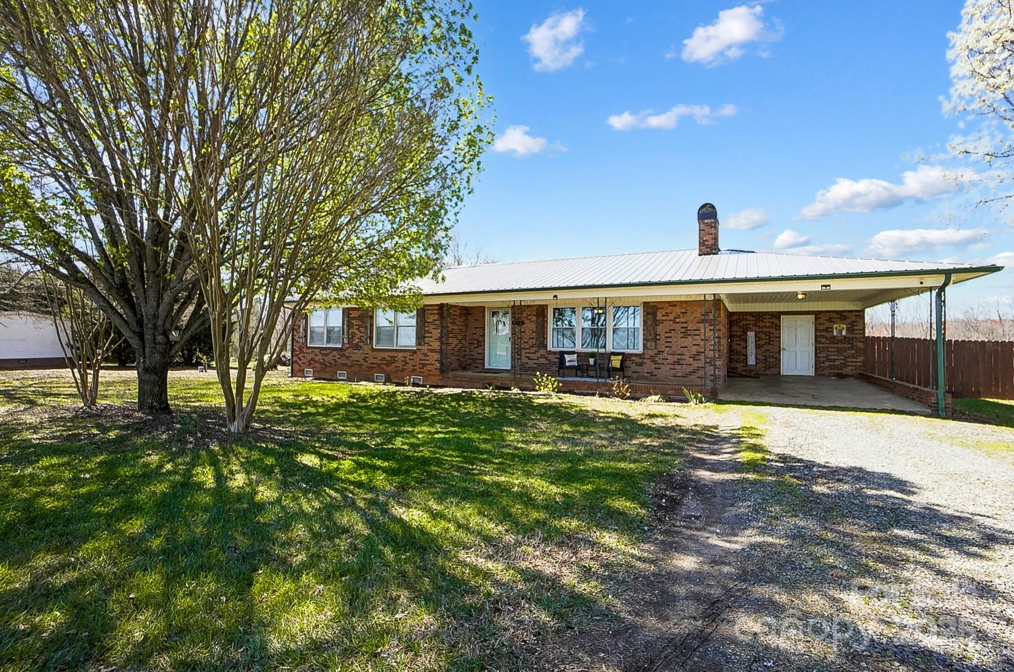 976 Pointview Lane Lincolnton, NC 28092 - Photo 1 of 43 a front view of a house with a garden