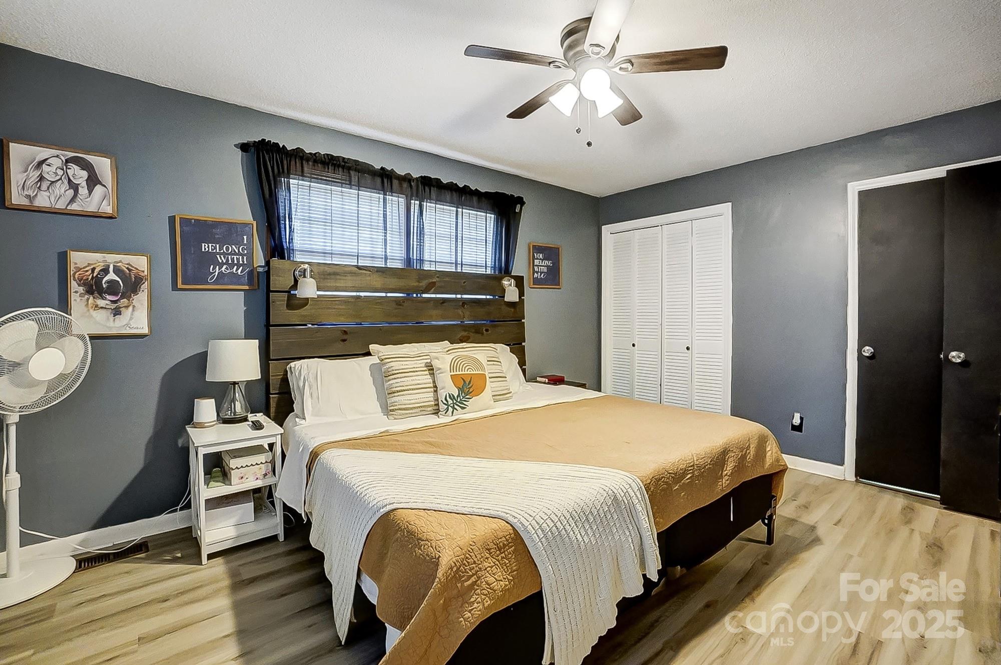 976 Pointview Lane Lincolnton, NC 28092 - Photo 22 of 43 a bedroom with a bed and a chandelier