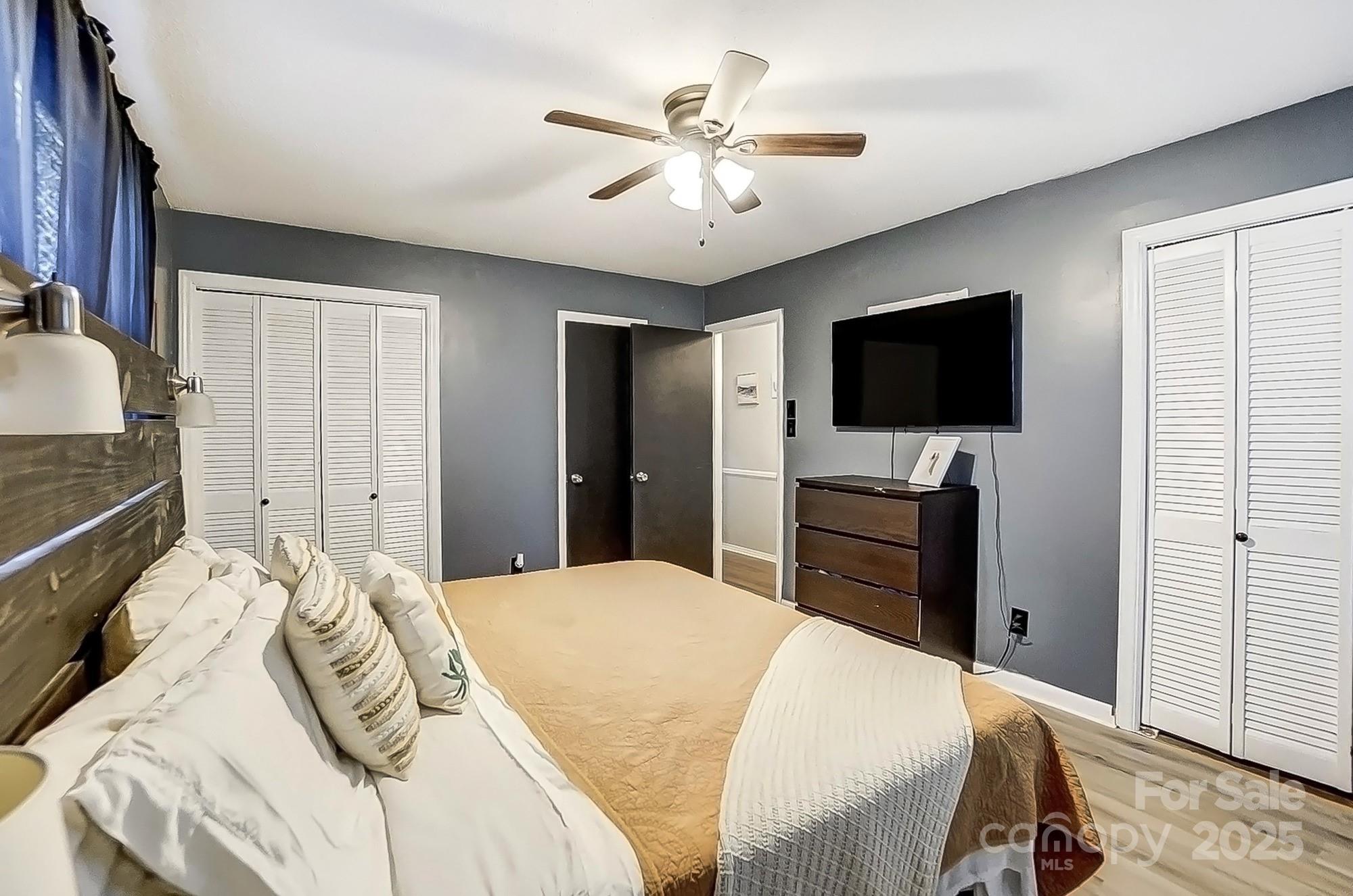 976 Pointview Lane Lincolnton, NC 28092 - Photo 23 of 43 a bedroom with a bed and a flat screen tv