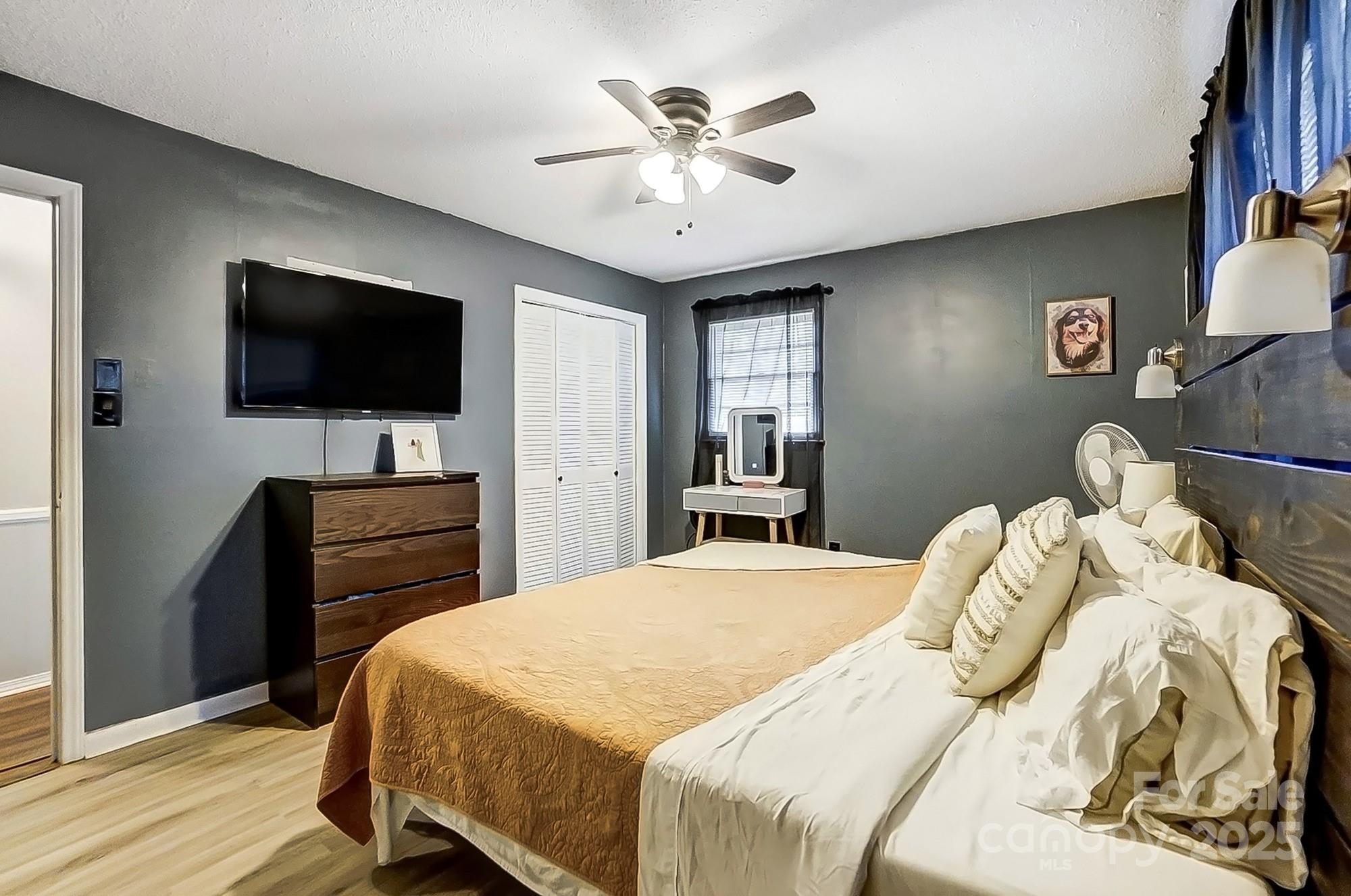 976 Pointview Lane Lincolnton, NC 28092 - Photo 24 of 43 a bedroom with a bed and a flat screen tv