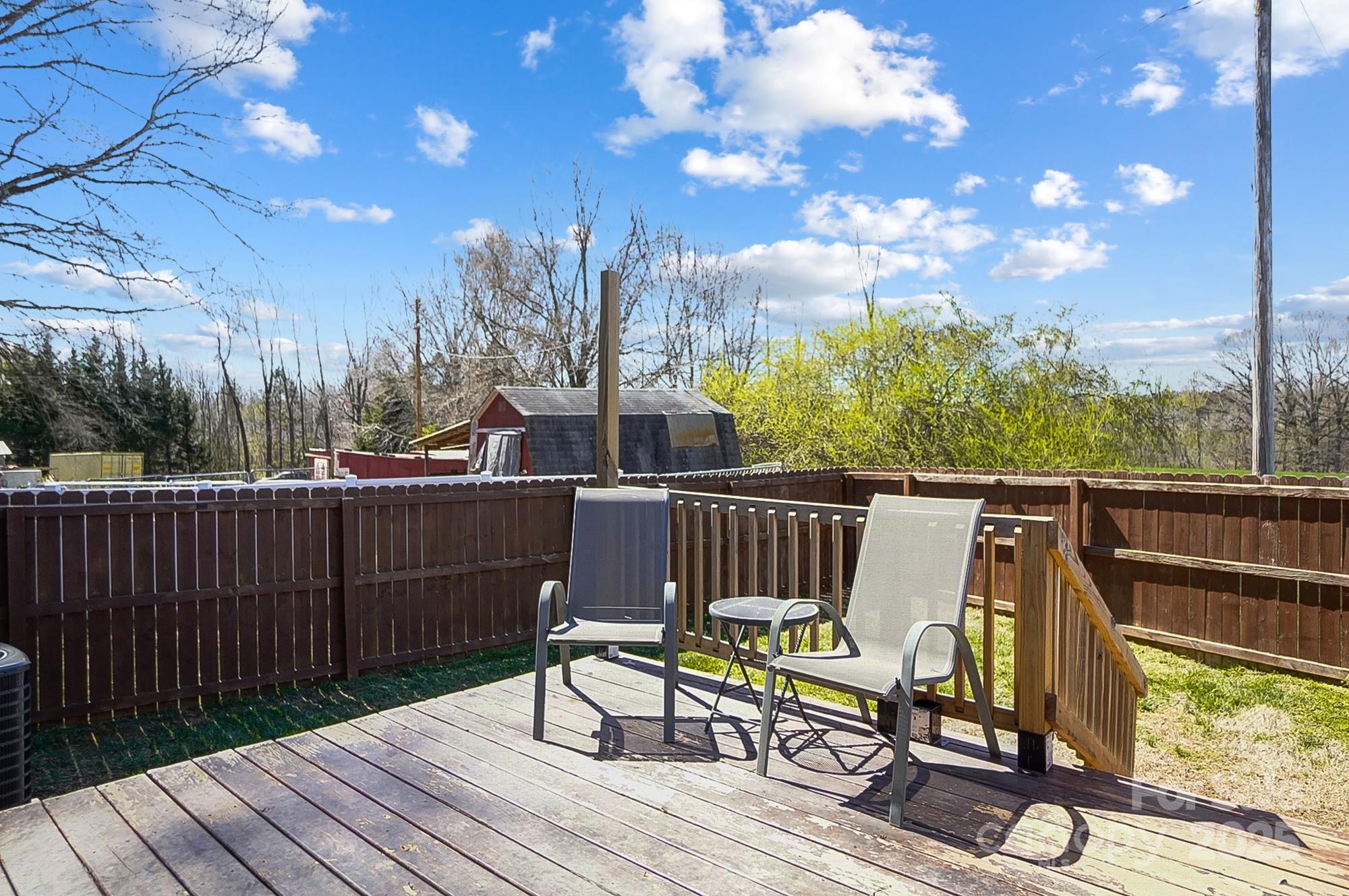 976 Pointview Lane Lincolnton, NC 28092 - Photo 40 of 43 a view of a chairs on wooden deck