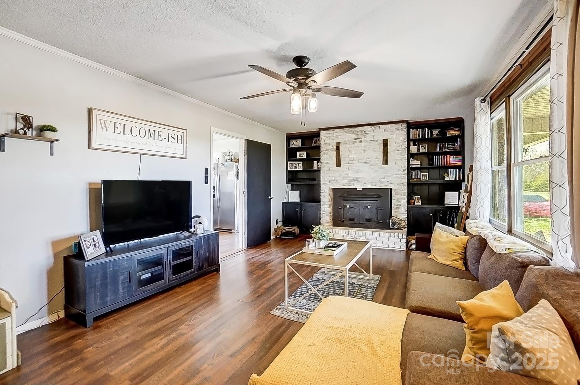 976 Pointview Lane Lincolnton, NC 28092 - Photo 9 of 43 a living room with furniture and a flat screen tv