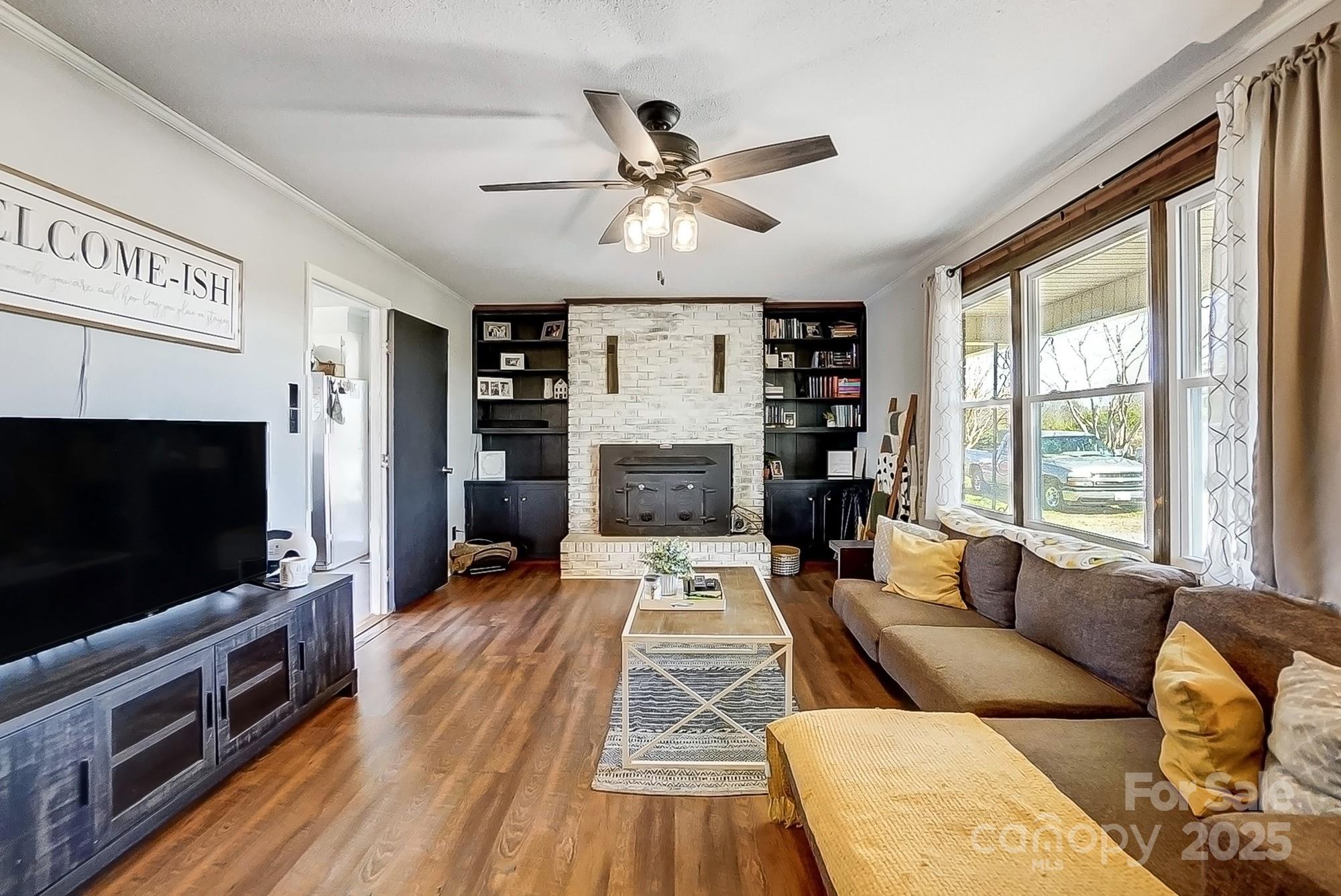 976 Pointview Lane Lincolnton, NC 28092 - Photo 10 of 43 a living room with furniture and a flat screen tv