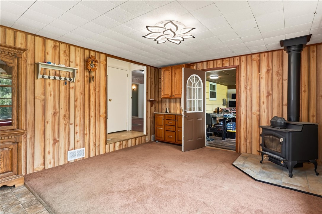 61 Faircrest Road Henrietta, NY 14623 - Photo 28 of 50 Dining room/family room with wood-burning stove
