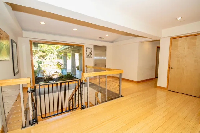 a view of a house with a yard patio and fire pit