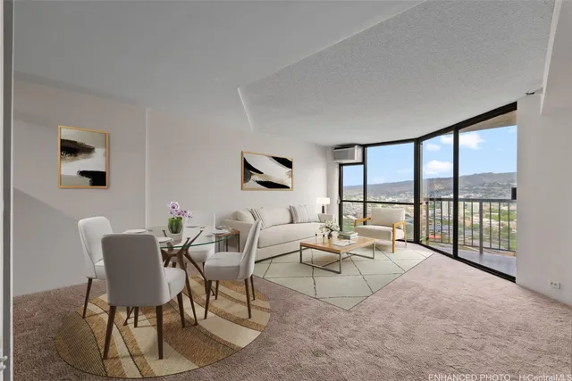 a living room with furniture and a floor to ceiling window