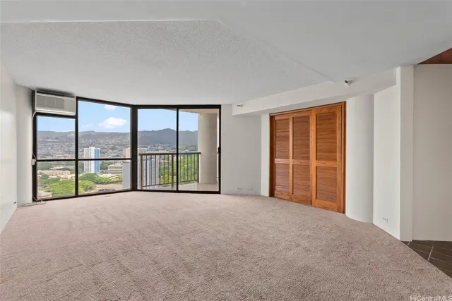 a view of an empty room with a large window