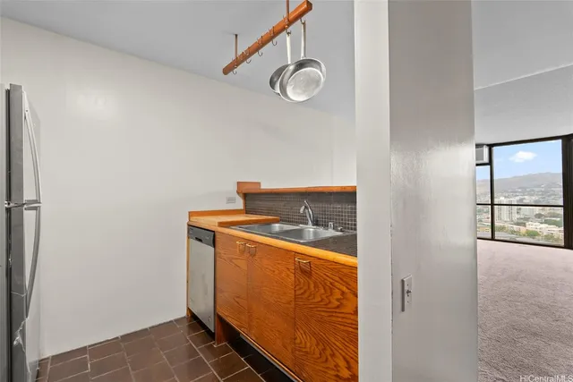 a bedroom with a bed and a potted plant