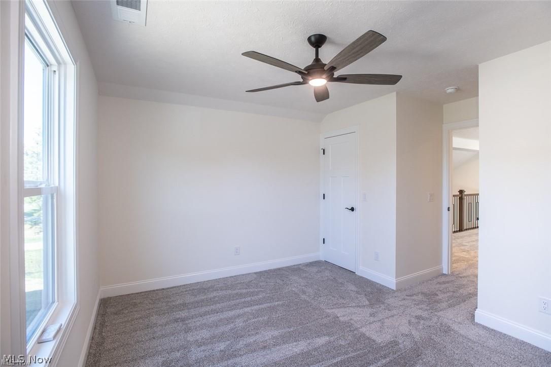 34286 Brookside Lane North Ridgeville, OH 44039 - Photo 43 of 50 Empty room featuring carpet flooring and ceiling fan