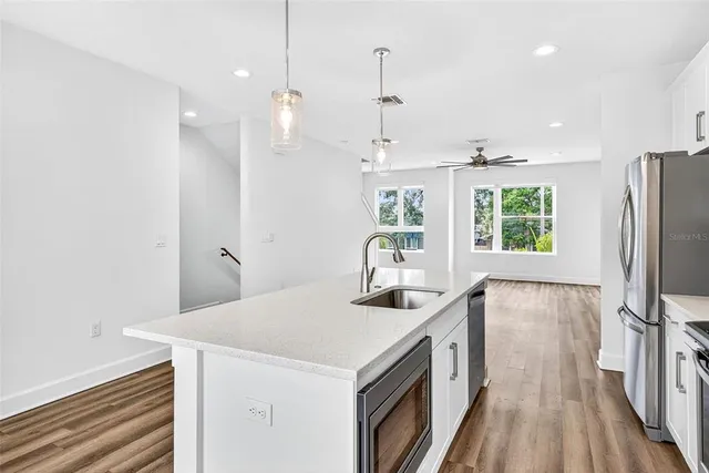 a close view of two washing machine with kitchen view