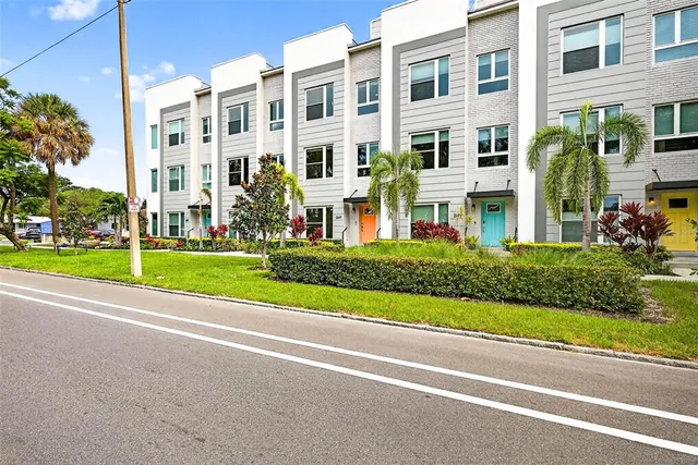 a view of a building with a yard