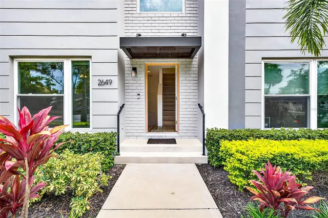 a view of a hallway with windows