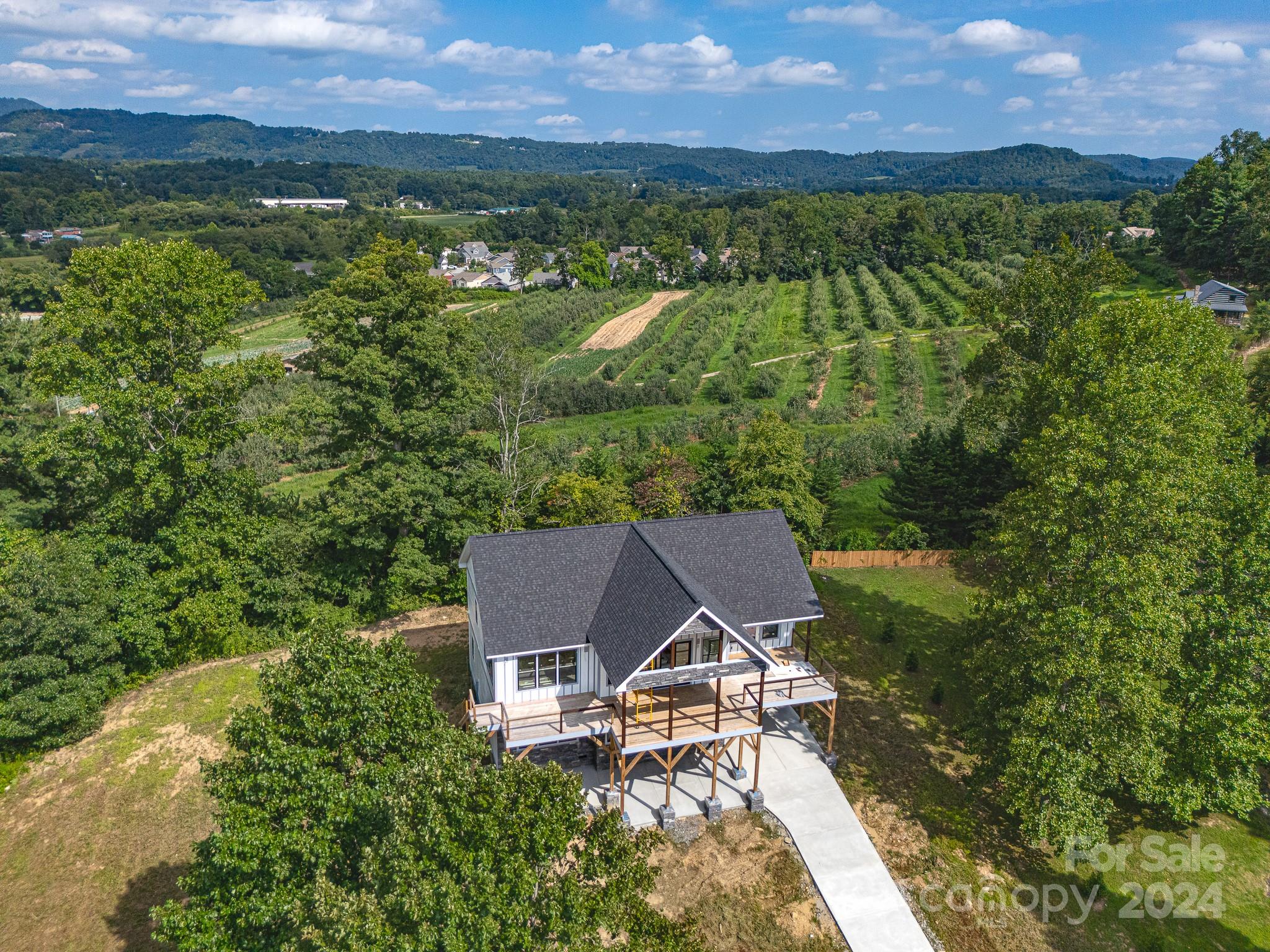 171 Tatham Road Hendersonville, NC 28792 - Photo 11 of 19 a view of a house with a yard