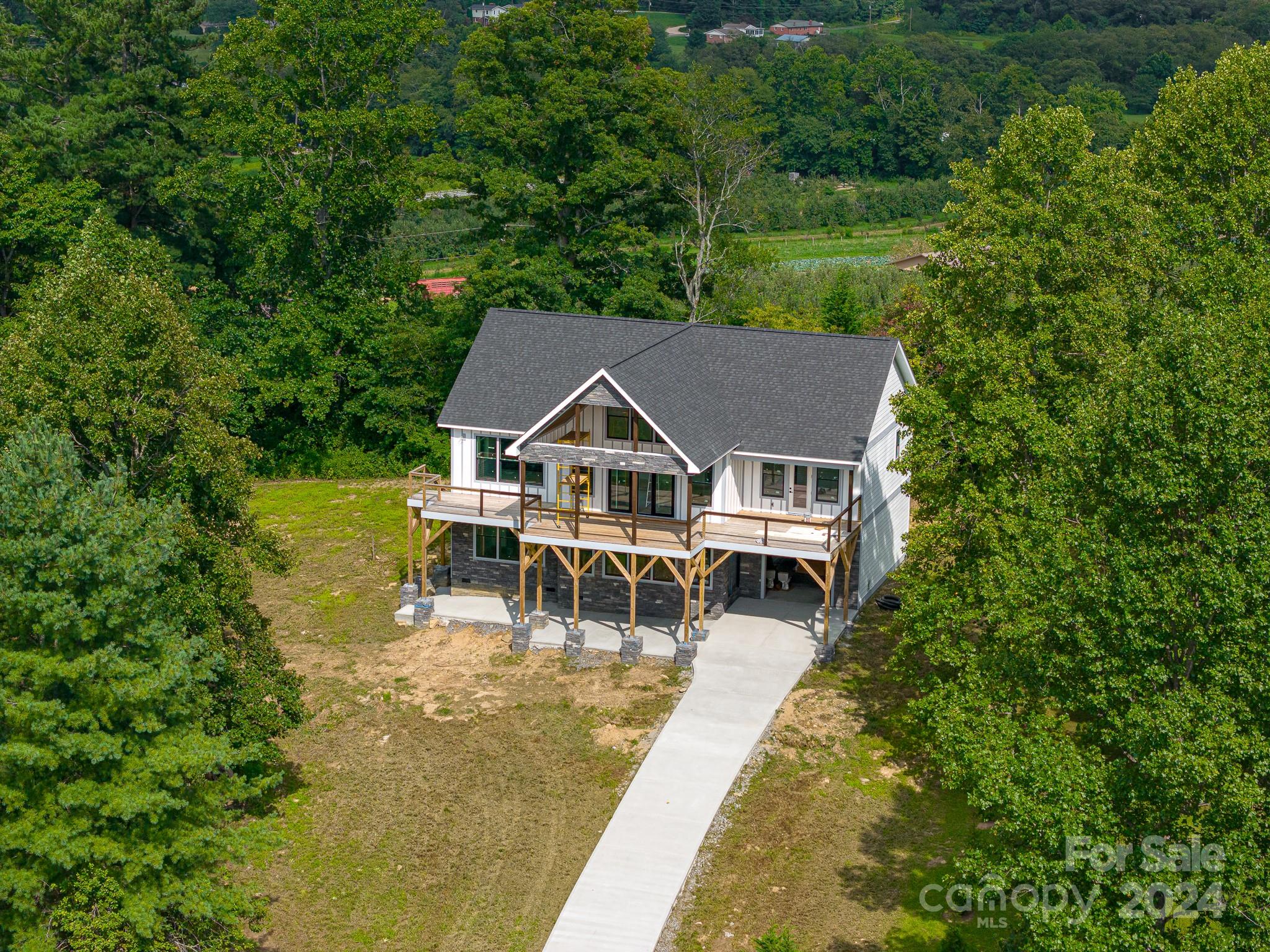 171 Tatham Road Hendersonville, NC 28792 - Photo 12 of 19 an aerial view of a house with swimming pool and garden