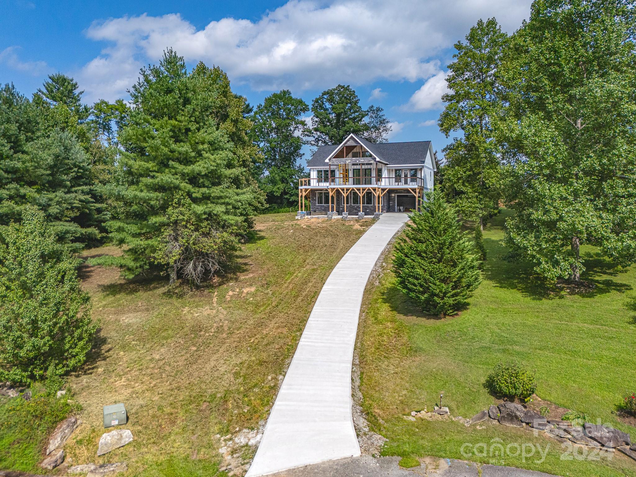 171 Tatham Road Hendersonville, NC 28792 - Photo 2 of 19 a front view of a house with a yard