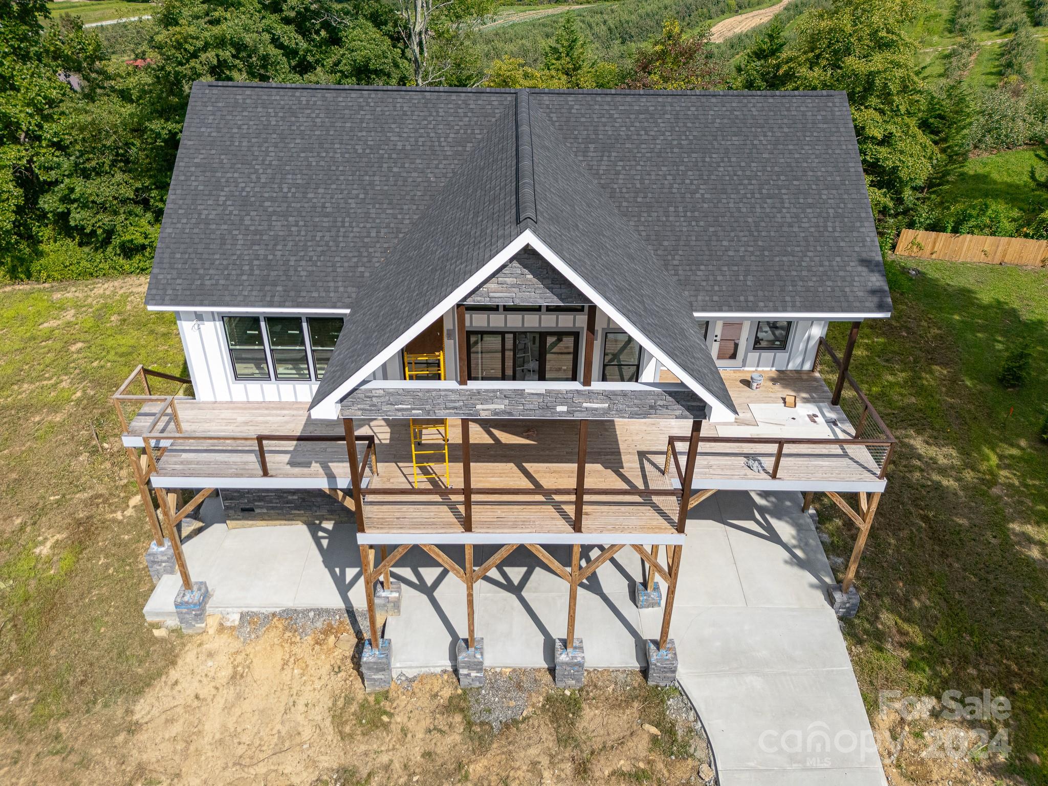 171 Tatham Road Hendersonville, NC 28792 - Photo 9 of 19 a aerial view of a house with table and chairs