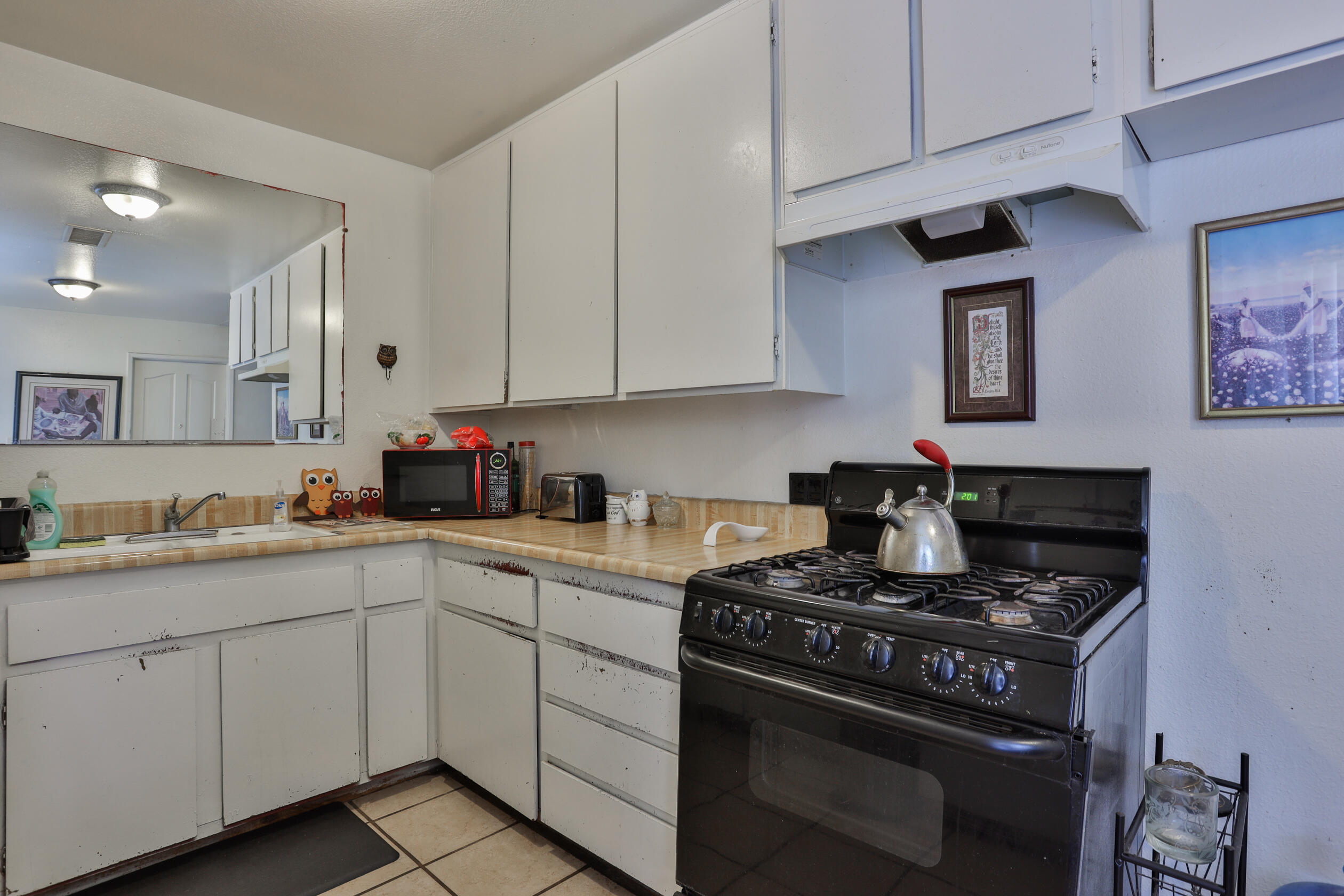 464 Riverside Avenue Rialto, CA 92376 - Photo 11 of 33 a kitchen with cabinets appliances and a sink