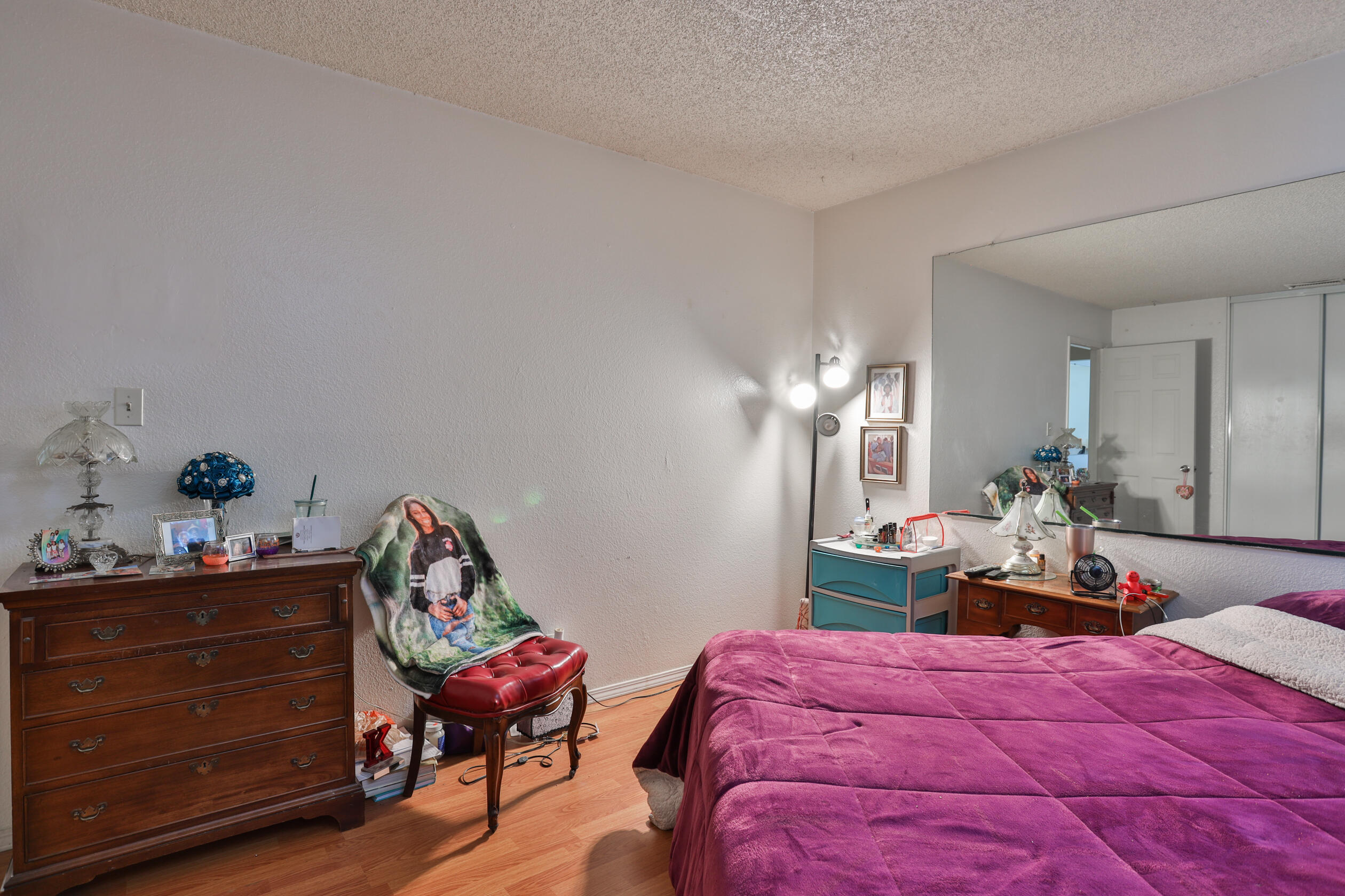 464 Riverside Avenue Rialto, CA 92376 - Photo 16 of 33 a bedroom with a bed and furniture