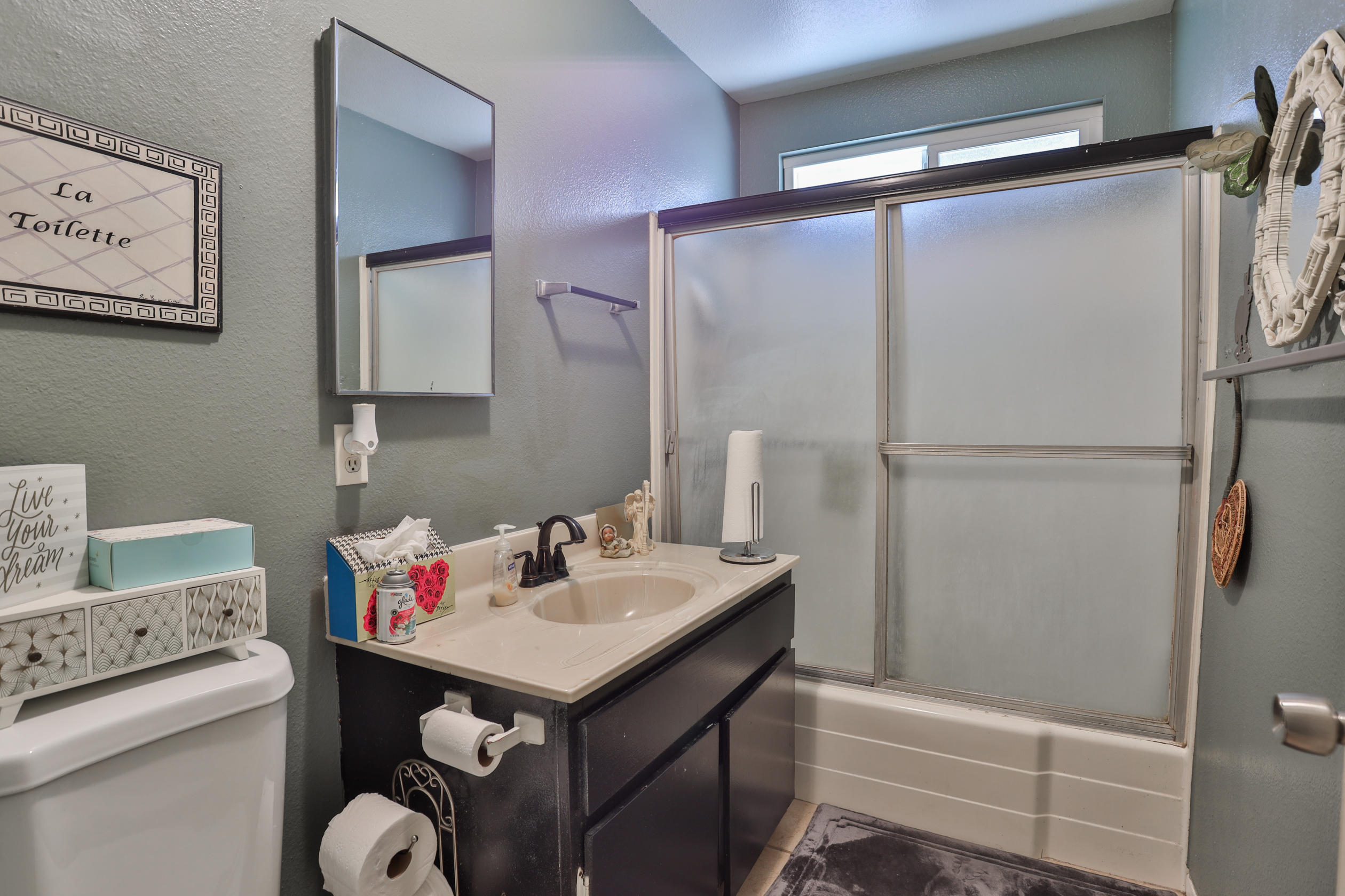 464 Riverside Avenue Rialto, CA 92376 - Photo 17 of 33 a bathroom with a sink toilet and shower