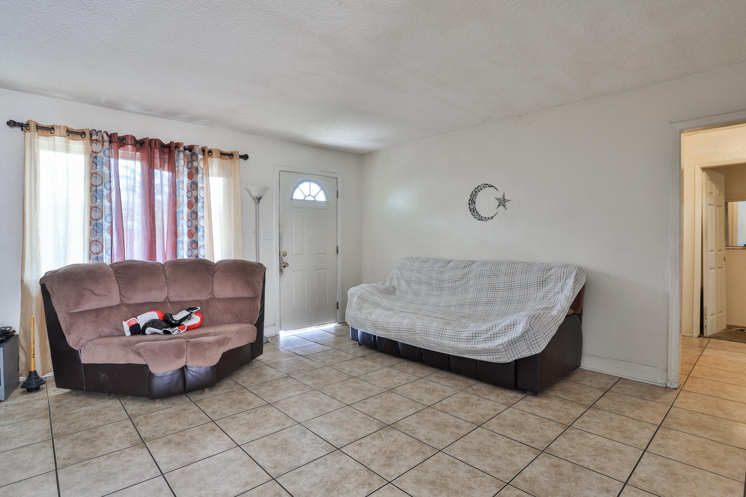 464 Riverside Avenue Rialto, CA 92376 - Photo 20 of 33 a living room with furniture and a window