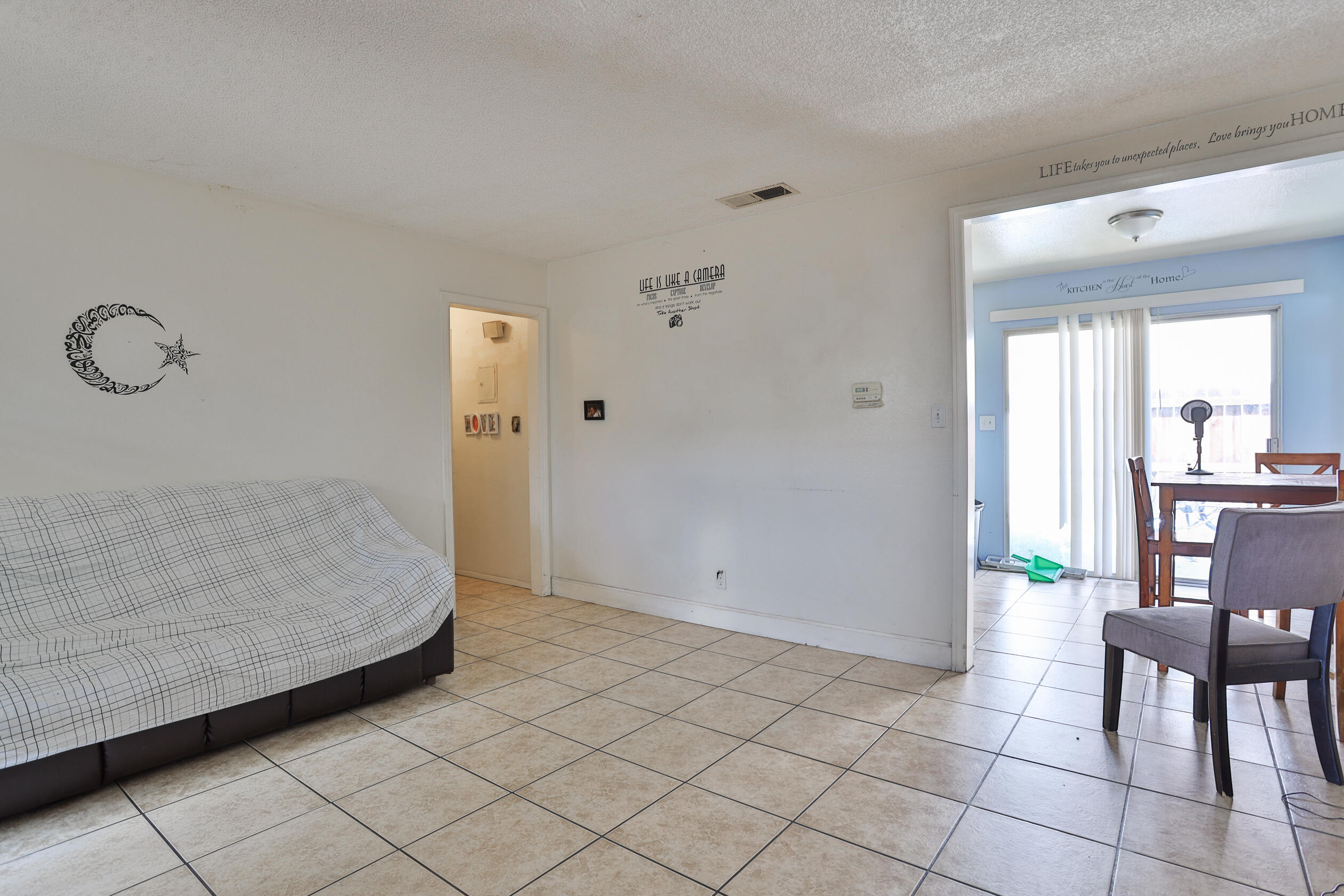 464 Riverside Avenue Rialto, CA 92376 - Photo 21 of 33 a view of room with furniture and wooden floor
