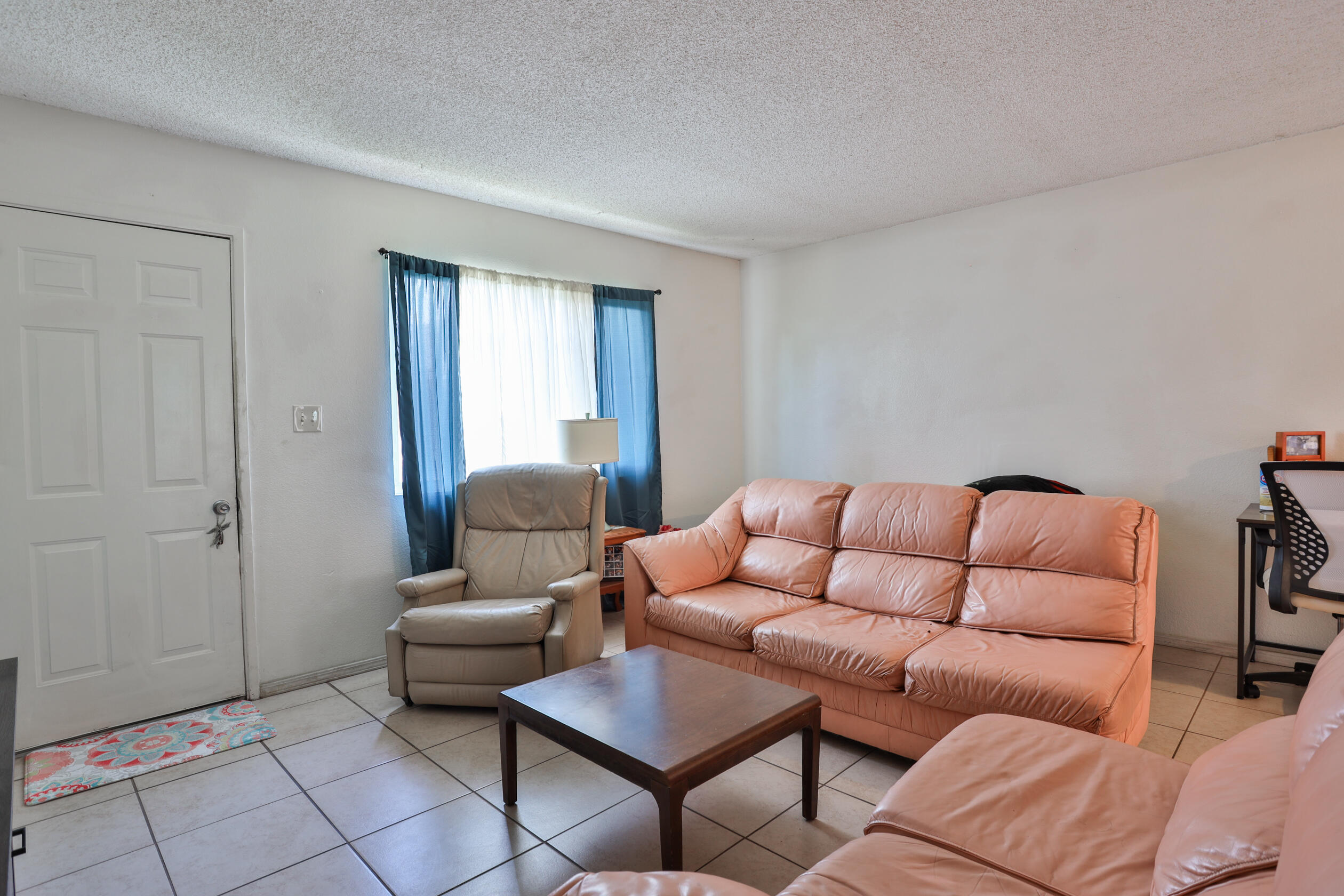 464 Riverside Avenue Rialto, CA 92376 - Photo 4 of 33 a living room with furniture and a window