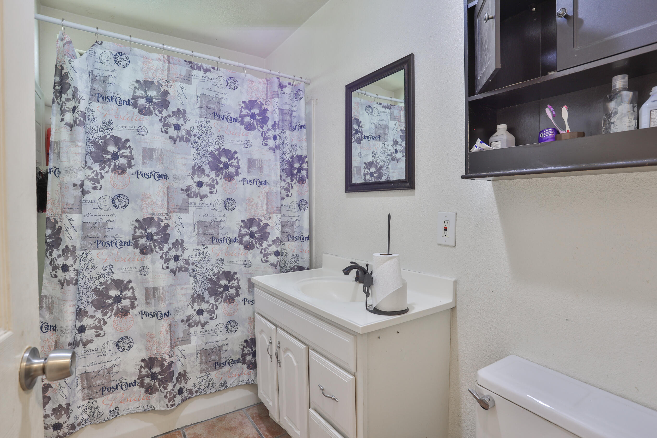 464 Riverside Avenue Rialto, CA 92376 - Photo 31 of 33 a bathroom with a sink and a mirror