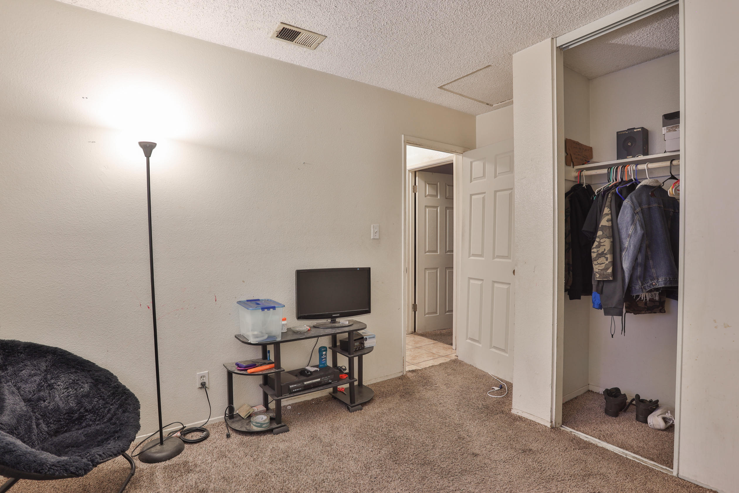 464 Riverside Avenue Rialto, CA 92376 - Photo 33 of 33 a view of a workspace with furniture and a bedroom