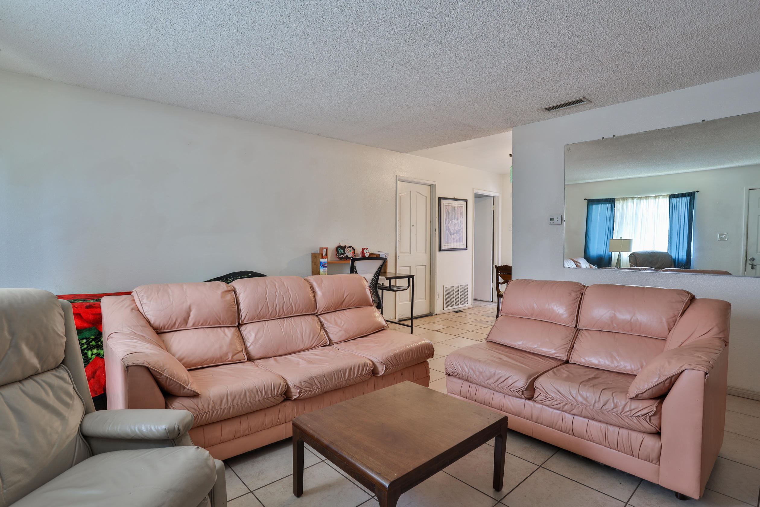 464 Riverside Avenue Rialto, CA 92376 - Photo 6 of 33 a living room with furniture and a couch