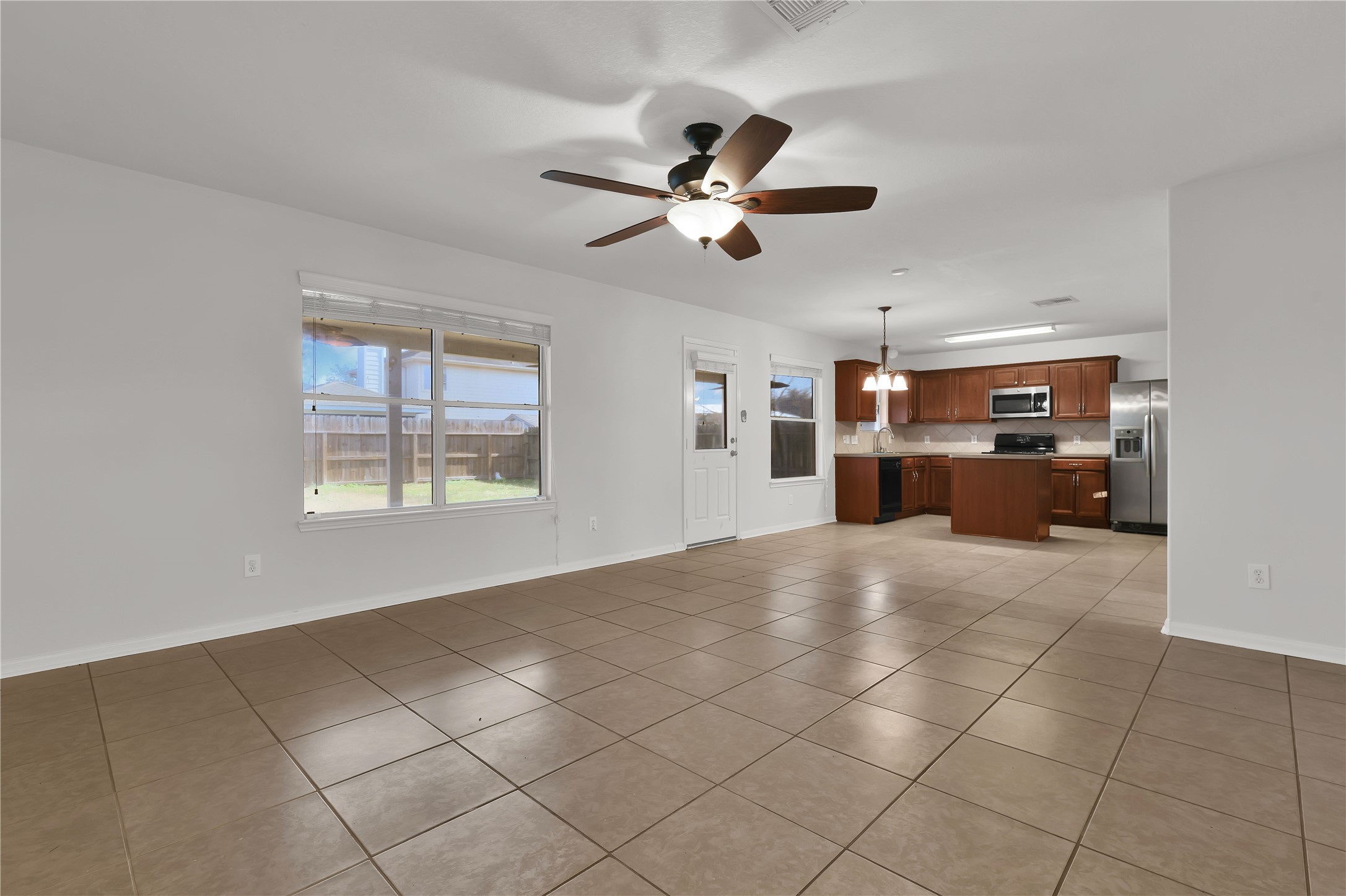 1906 Rock Ridge Drive Houston, TX 77049 - Photo 6 of 32 Living Room is open to Kitchen
and offers a great back yard view