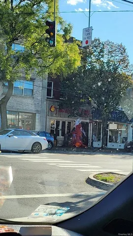 a view of a car park in front of the house