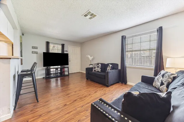 a living room with furniture and a table