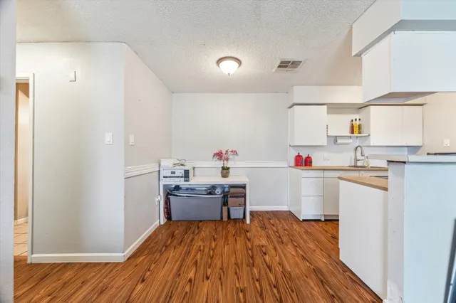 a bedroom with furniture and a flat screen tv