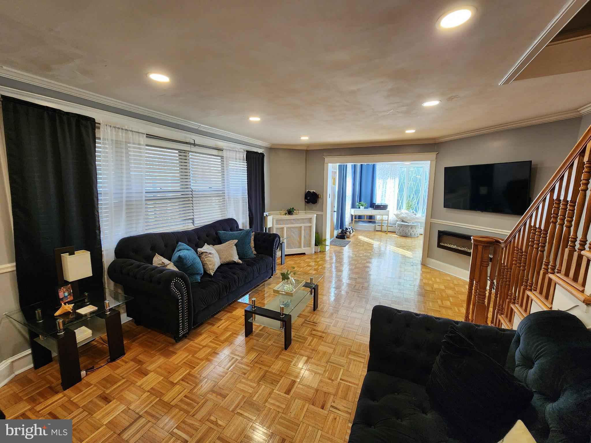 1729 68th Avenue Philadelphia, PA 19126 - Photo 14 of 38 a living room with furniture and a flat screen tv