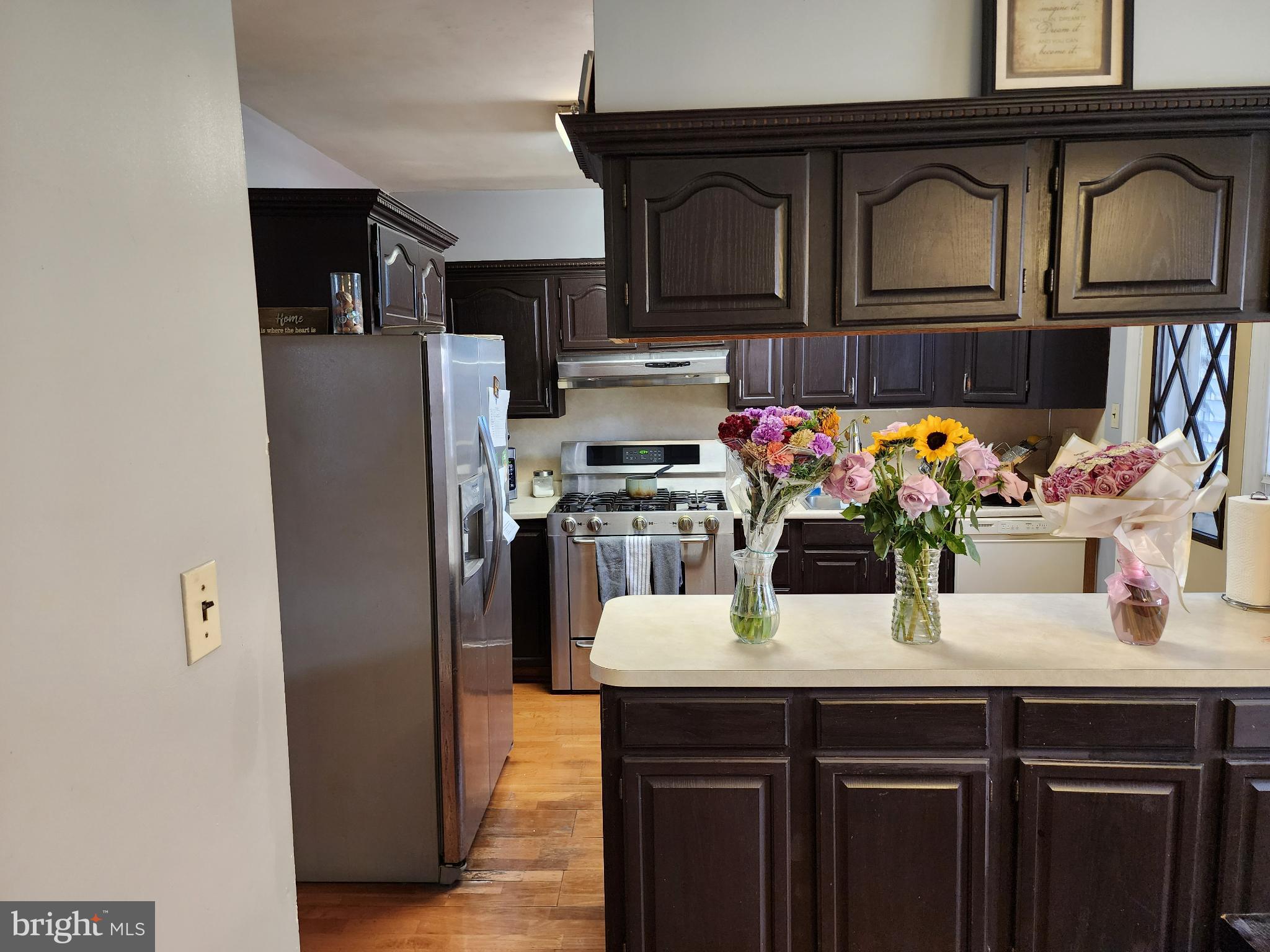 1729 68th Avenue Philadelphia, PA 19126 - Photo 21 of 38 a kitchen with stainless steel appliances a sink and cabinets