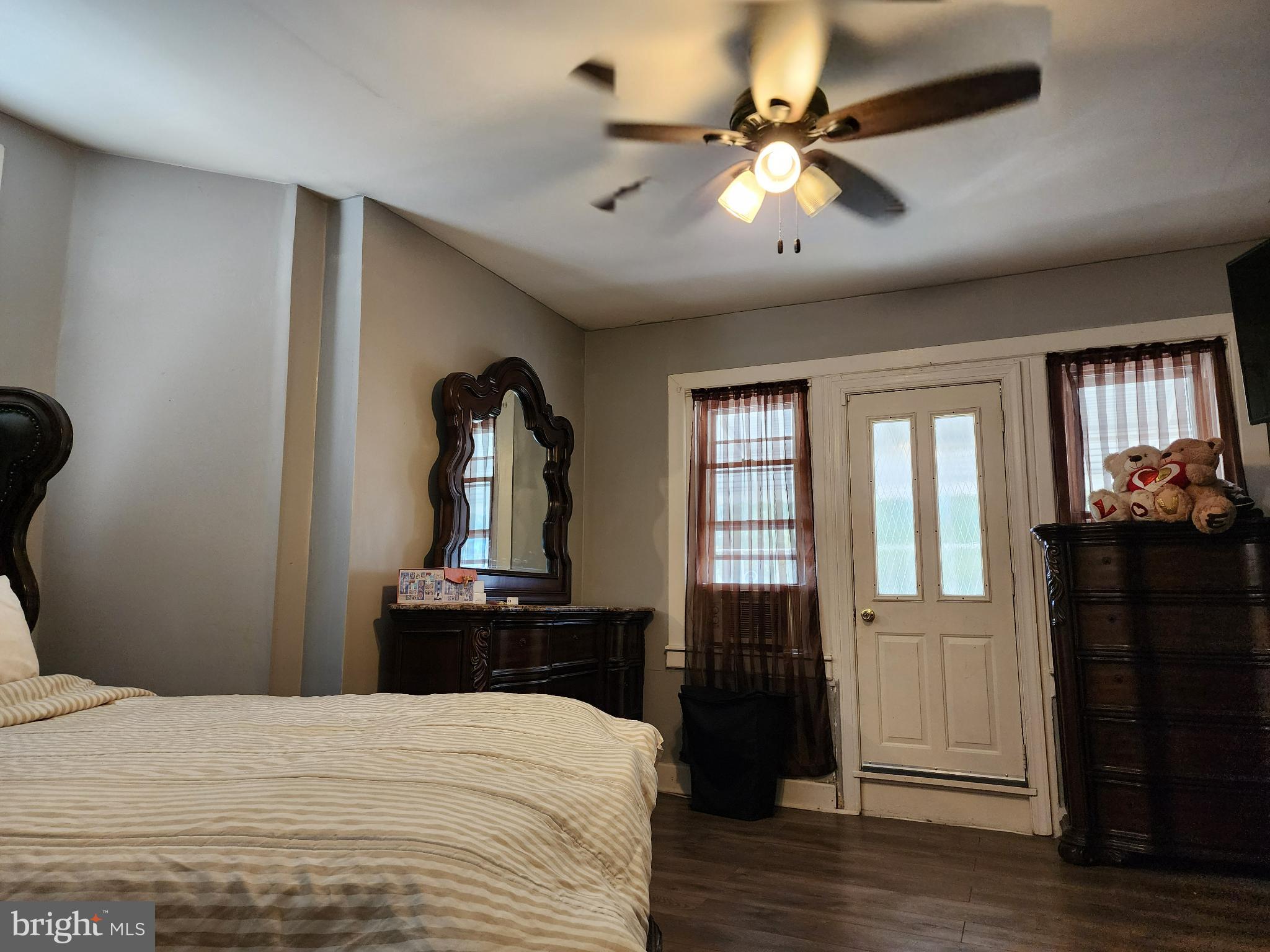 1729 68th Avenue Philadelphia, PA 19126 - Photo 26 of 38 a bedroom with a bed and wooden floor