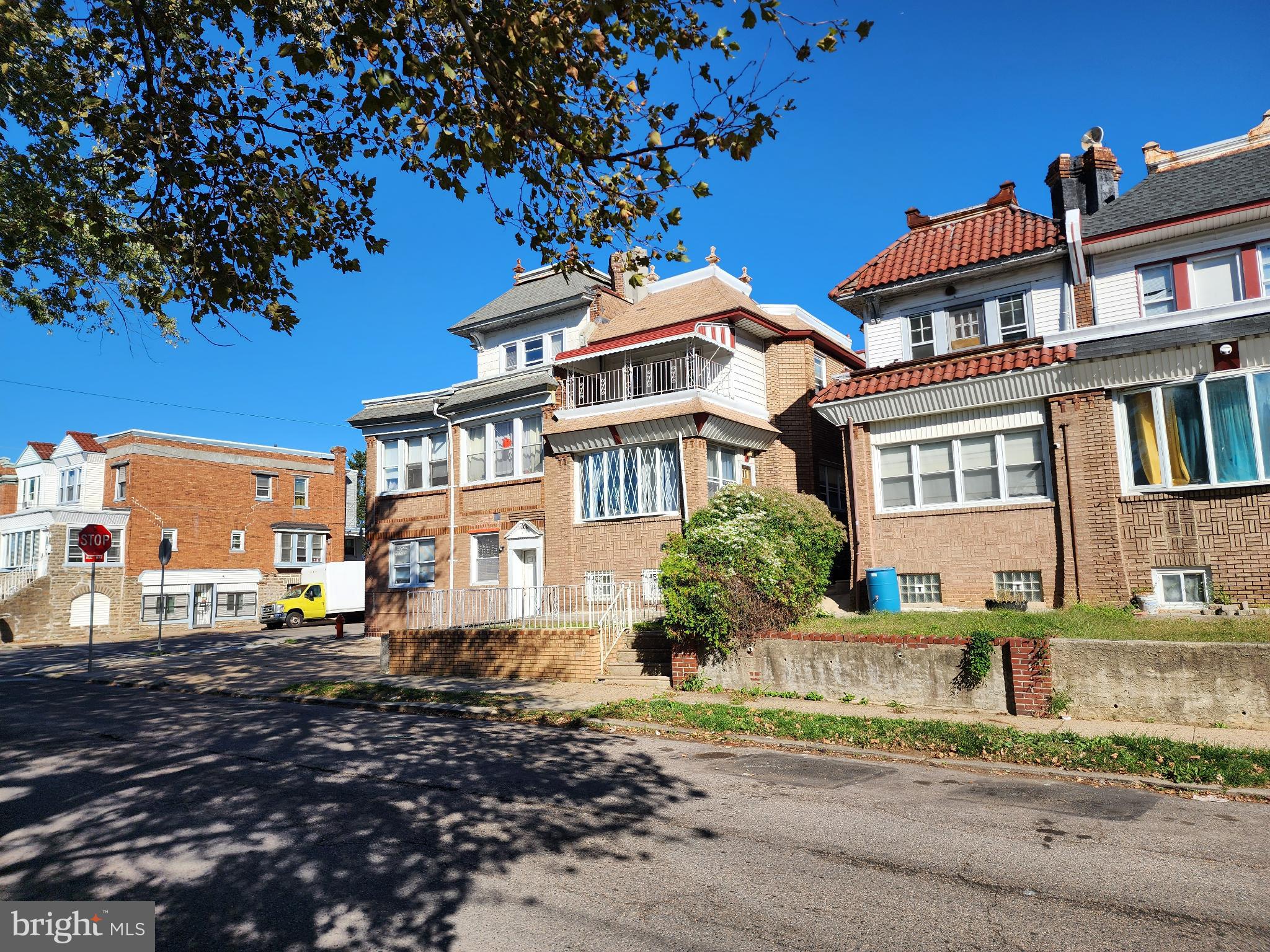 1729 68th Avenue Philadelphia, PA 19126 - Photo 3 of 38 a front view of a residential apartment building with a yard