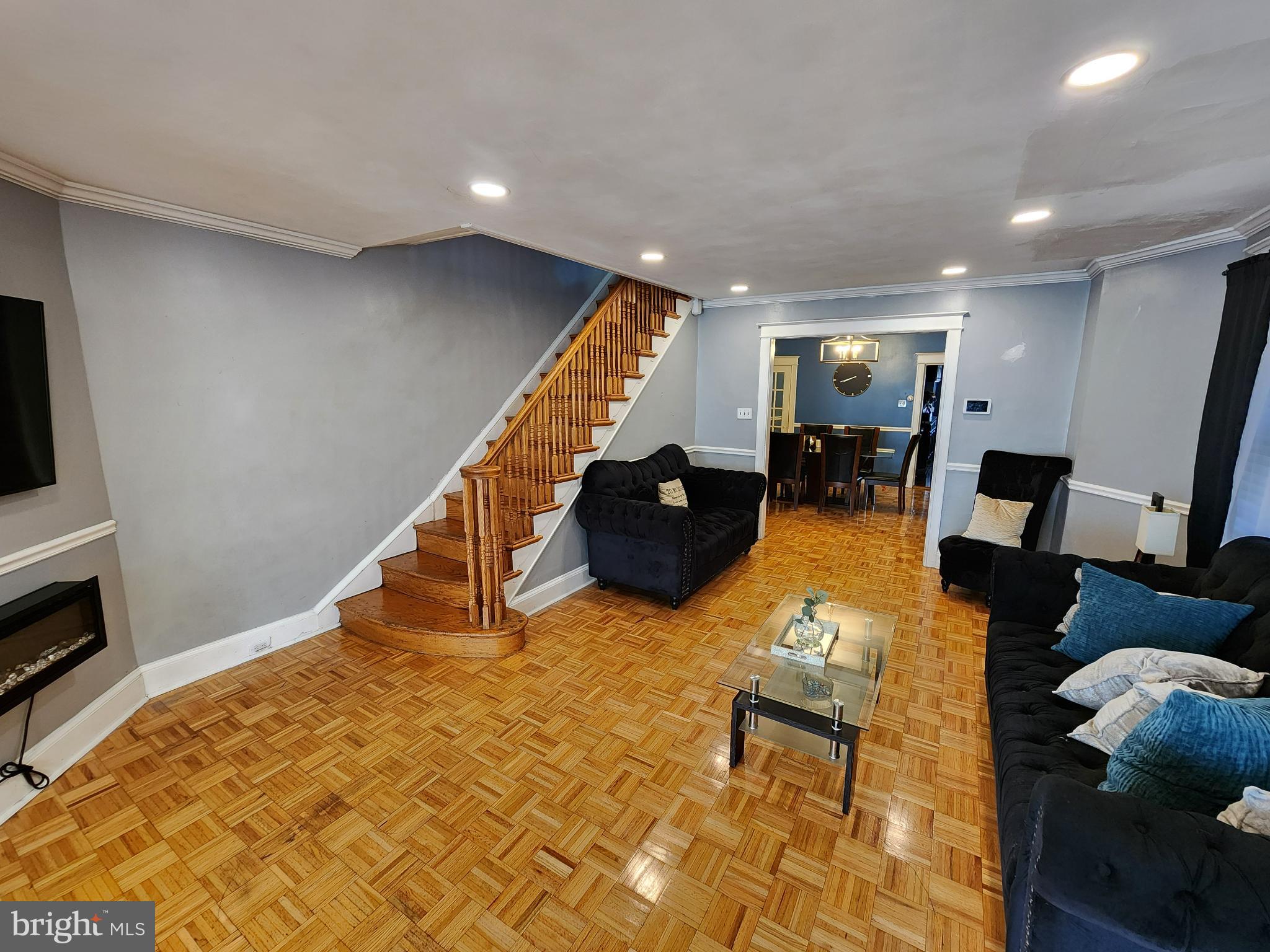 1729 68th Avenue Philadelphia, PA 19126 - Photo 9 of 38 a living room with furniture and a flat screen tv
