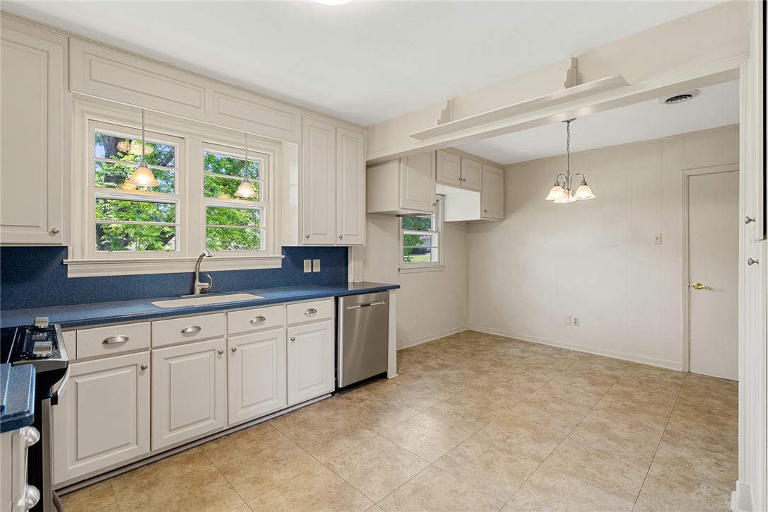 1509 869 Anderson, SC 29621 - Photo 18 of 45 A well-lit kitchen with ample cabinetry and an adjoining dining space for effortless entertaining.