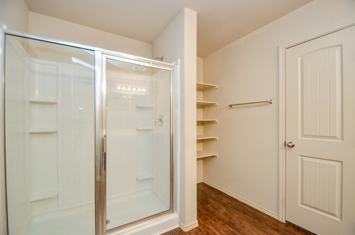 20114 Louetta Ash Drive Spring, TX 77388 - Photo 19 of 32 a bathroom with a glass shower door