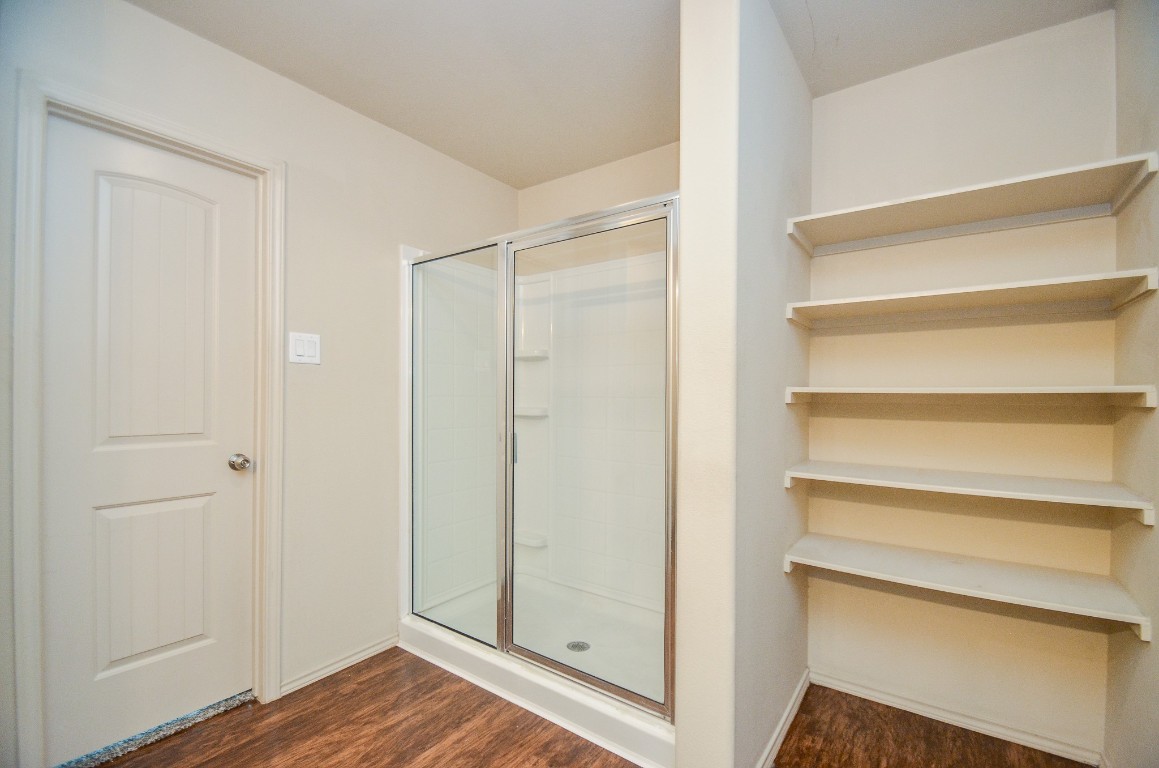 20114 Louetta Ash Drive Spring, TX 77388 - Photo 20 of 32 a view of walk in closet with empty racks