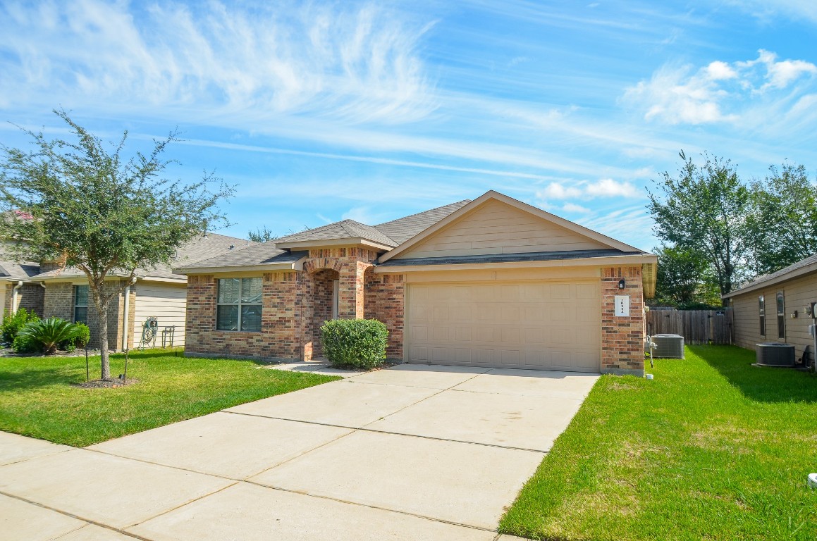 20114 Louetta Ash Drive Spring, TX 77388 - Photo 2 of 32 a front view of house with yard and green space
