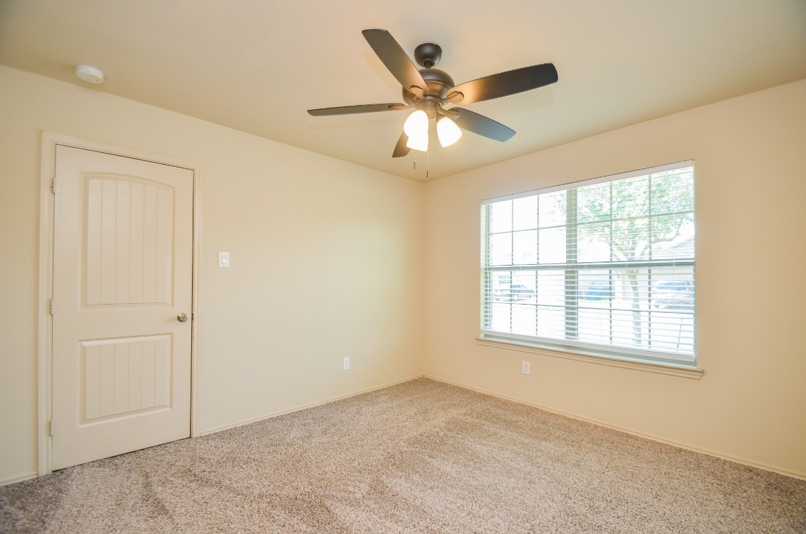20114 Louetta Ash Drive Spring, TX 77388 - Photo 23 of 32 an empty room with a window and a fan