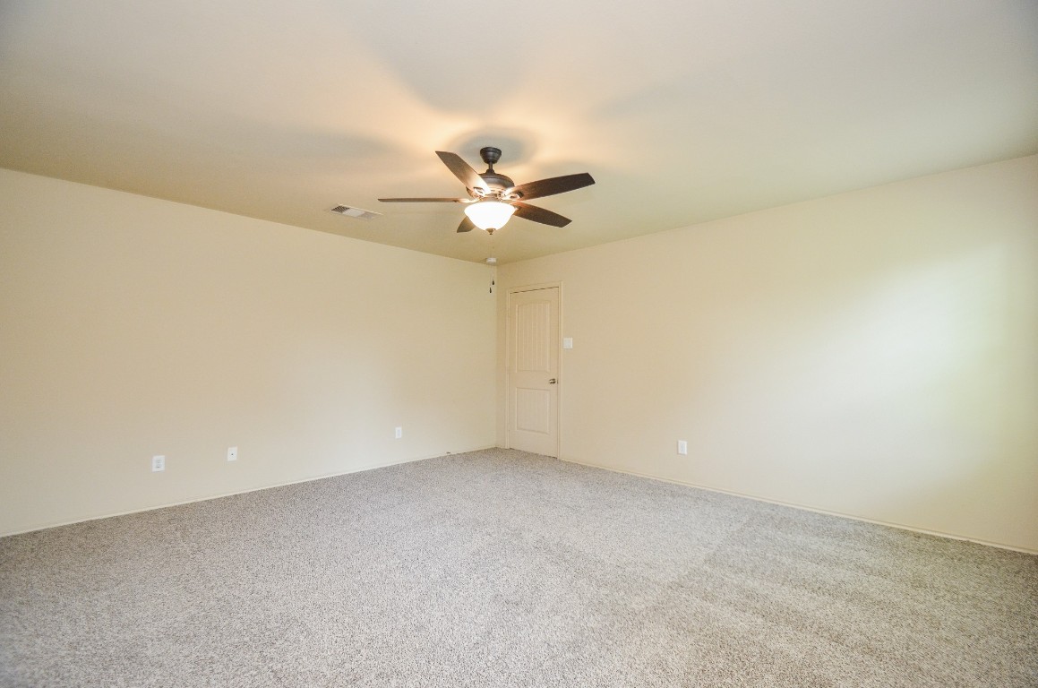 20114 Louetta Ash Drive Spring, TX 77388 - Photo 25 of 32 an empty room with a ceiling fan and a window