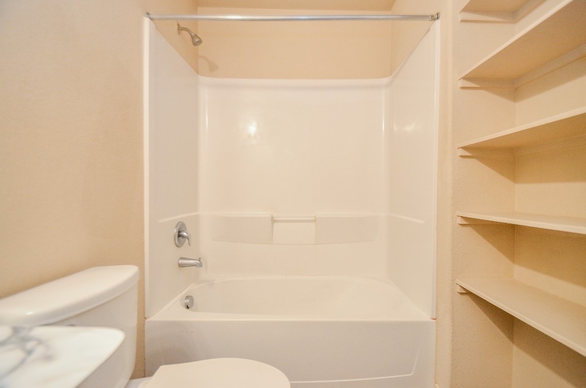 20114 Louetta Ash Drive Spring, TX 77388 - Photo 28 of 32 a bathroom with a toilet and a shower